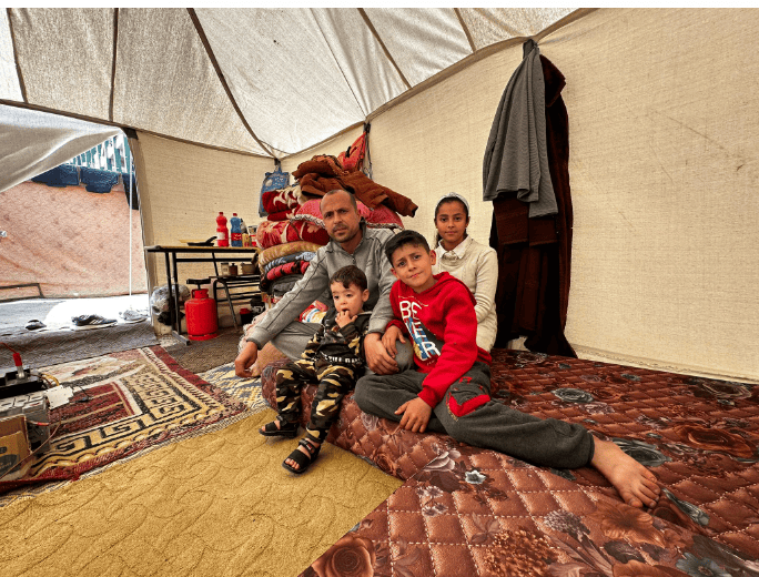 Father and children in tent