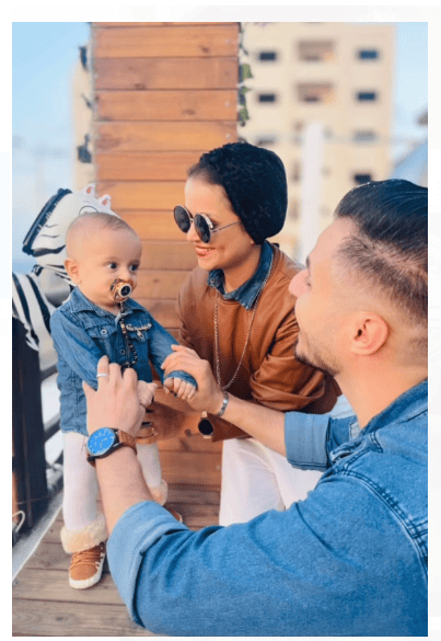 Wife and Husband playing with infant