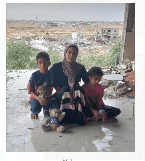 Family Posing in front of rubble