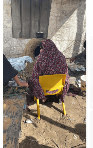 Woman sitting in chair facing away from Camera